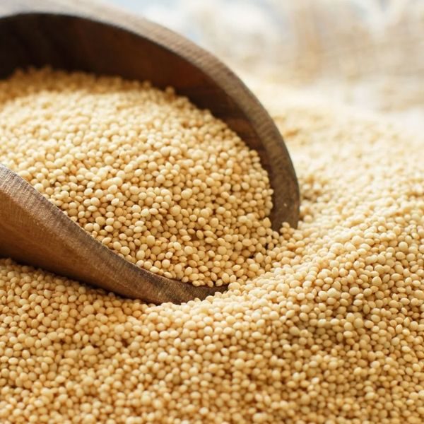 Black sesame and white sesame seed on wooden spoon
